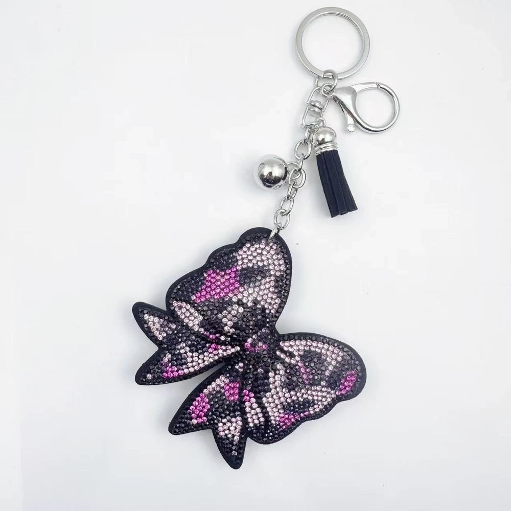Large bow-shaped rhinestone fancy beads in silver, hot pink, lavender, and lime green on a white background. - Pink
