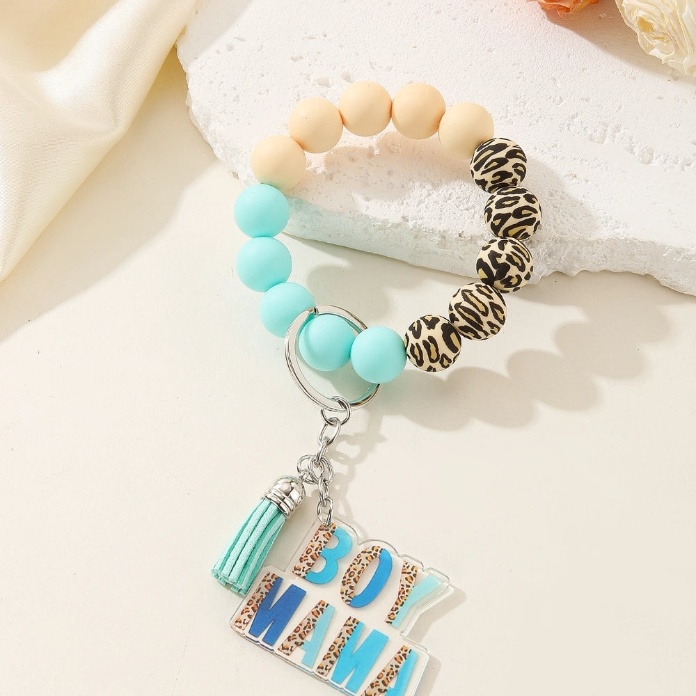 Colorful leopard print and solid silicone beaded bracelet keychains with Girl Mama and Boy Mama acrylic charms in pink and blue color schemes - 2