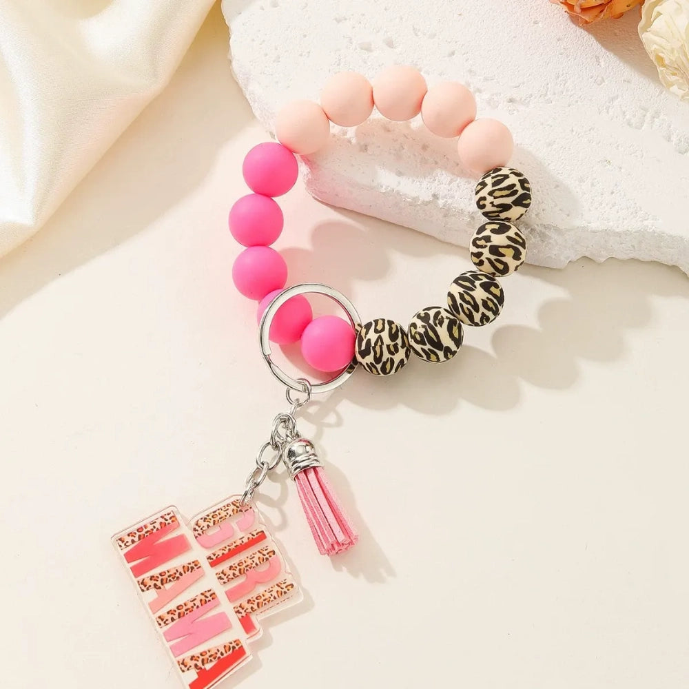 Colorful leopard print and solid silicone beaded bracelet keychains with Girl Mama and Boy Mama acrylic charms in pink and blue color schemes - 4