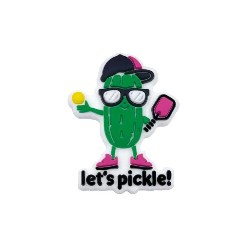 Silicone focal beads featuring a cartoon pickle character wearing glasses and a black cap holding a pickleball paddle with 'Let's Pickle!' text, shown in multiple sizes on a linen background. - Dark Green
