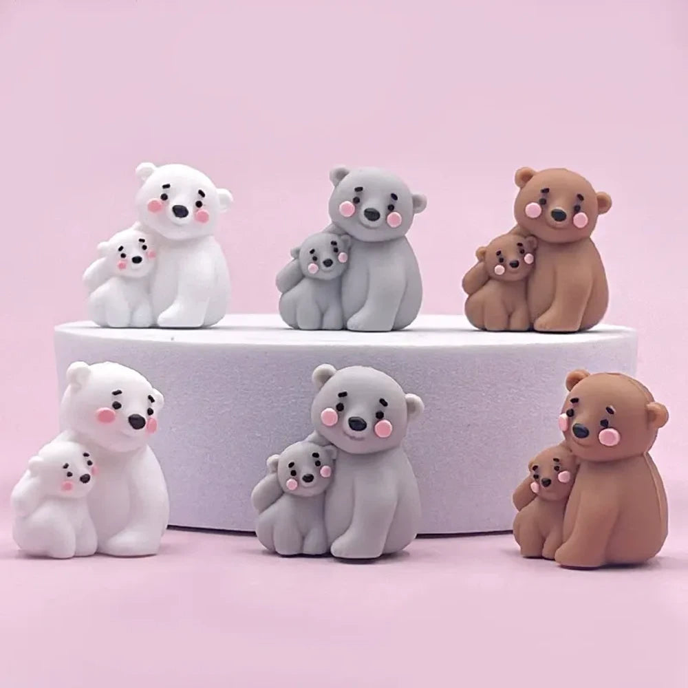Cute mama and baby bear silicone focal beads in white, gray, and brown colorways displayed on a pink background, perfect for beadable pens, keychains, and badge reels.