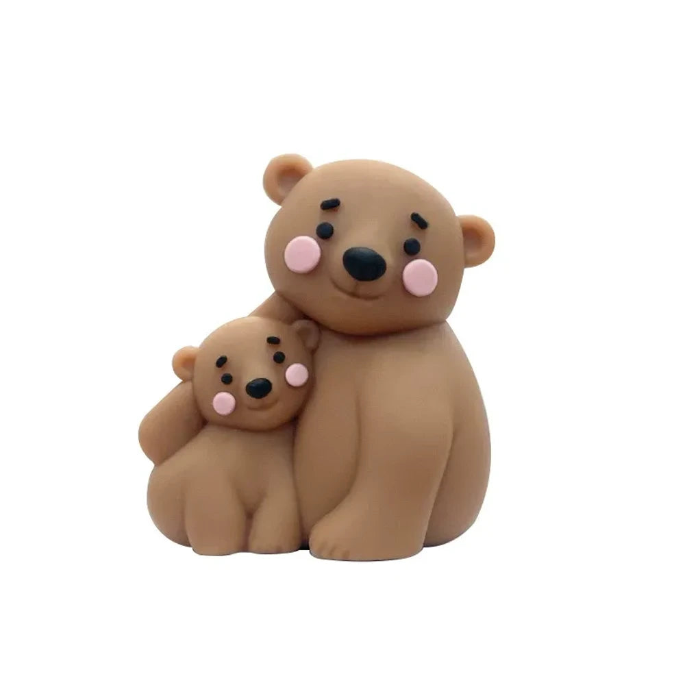Cute mama and baby bear silicone focal beads in white, gray, and brown colorways displayed on a pink background, perfect for beadable pens, keychains, and badge reels. - Camel