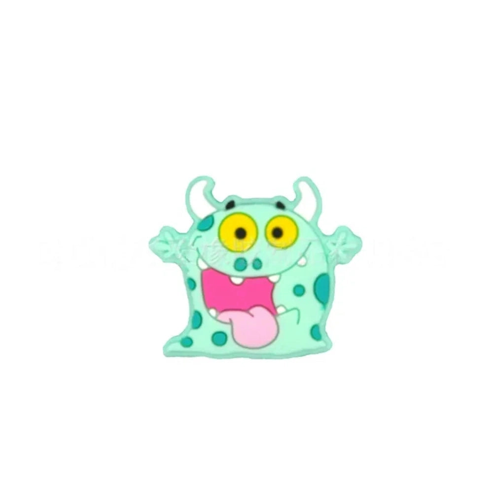 Assorted cartoon monster silicone focal beads in pink, yellow, gray, and mint green with big yellow eyes and horns, displayed in a white ceramic dish for DIY crafting projects. - 1