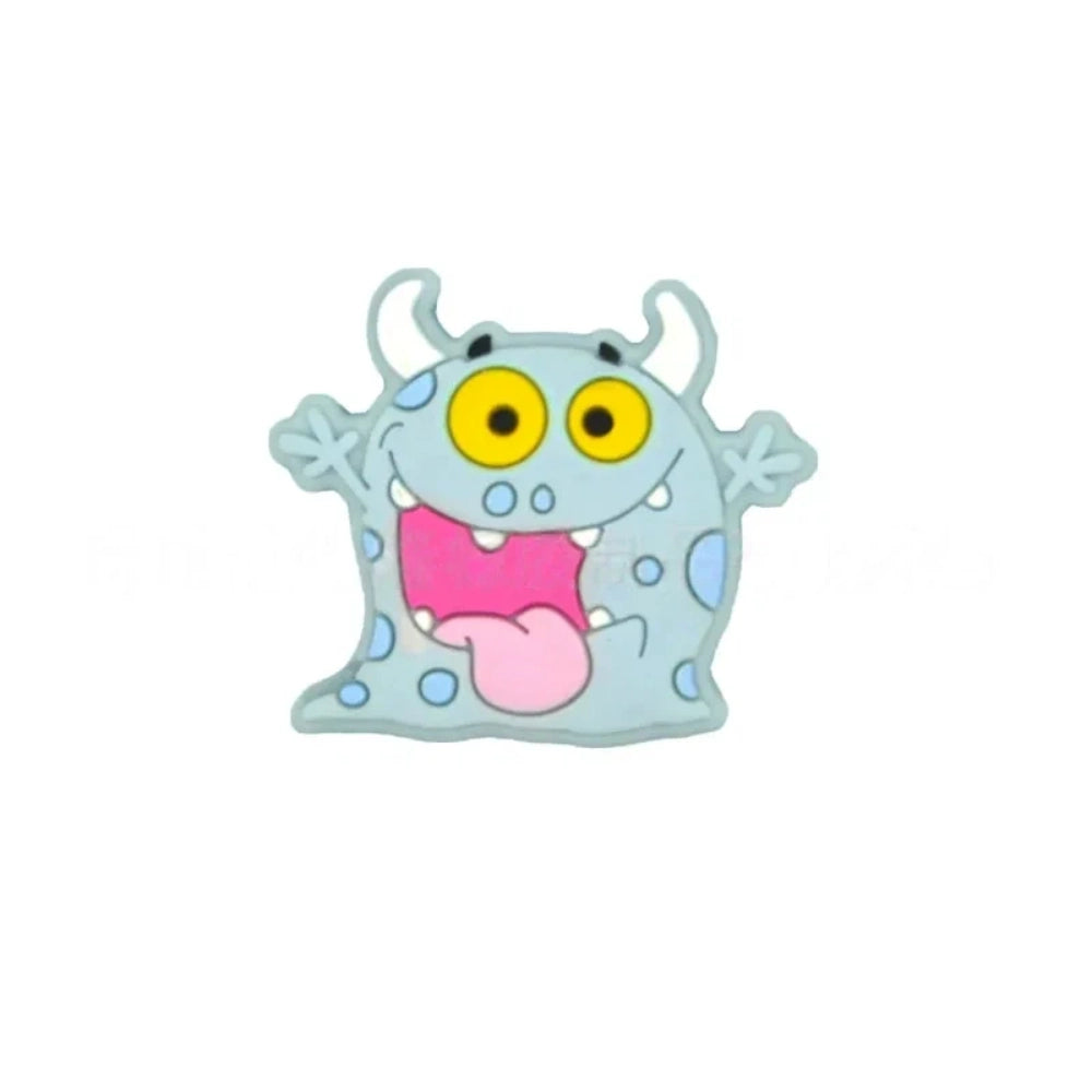 Assorted cartoon monster silicone focal beads in pink, yellow, gray, and mint green with big yellow eyes and horns, displayed in a white ceramic dish for DIY crafting projects. - 2