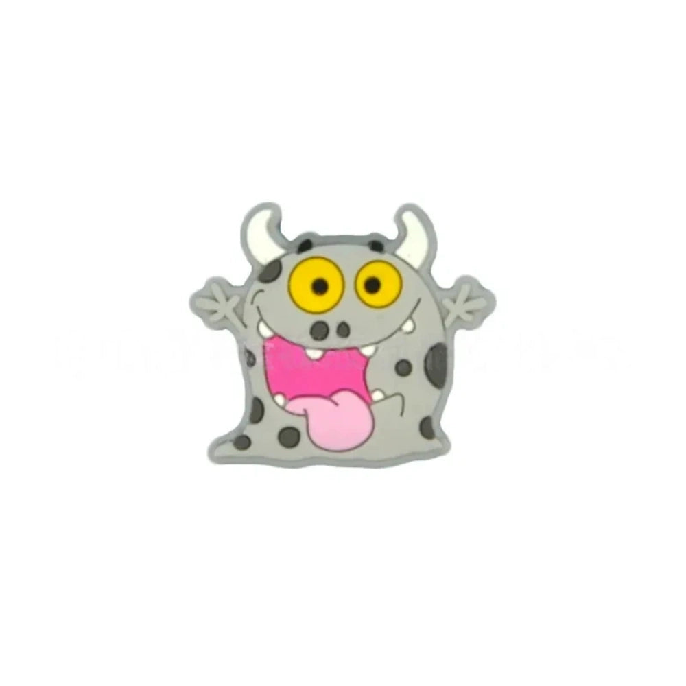 Assorted cartoon monster silicone focal beads in pink, yellow, gray, and mint green with big yellow eyes and horns, displayed in a white ceramic dish for DIY crafting projects. - 4