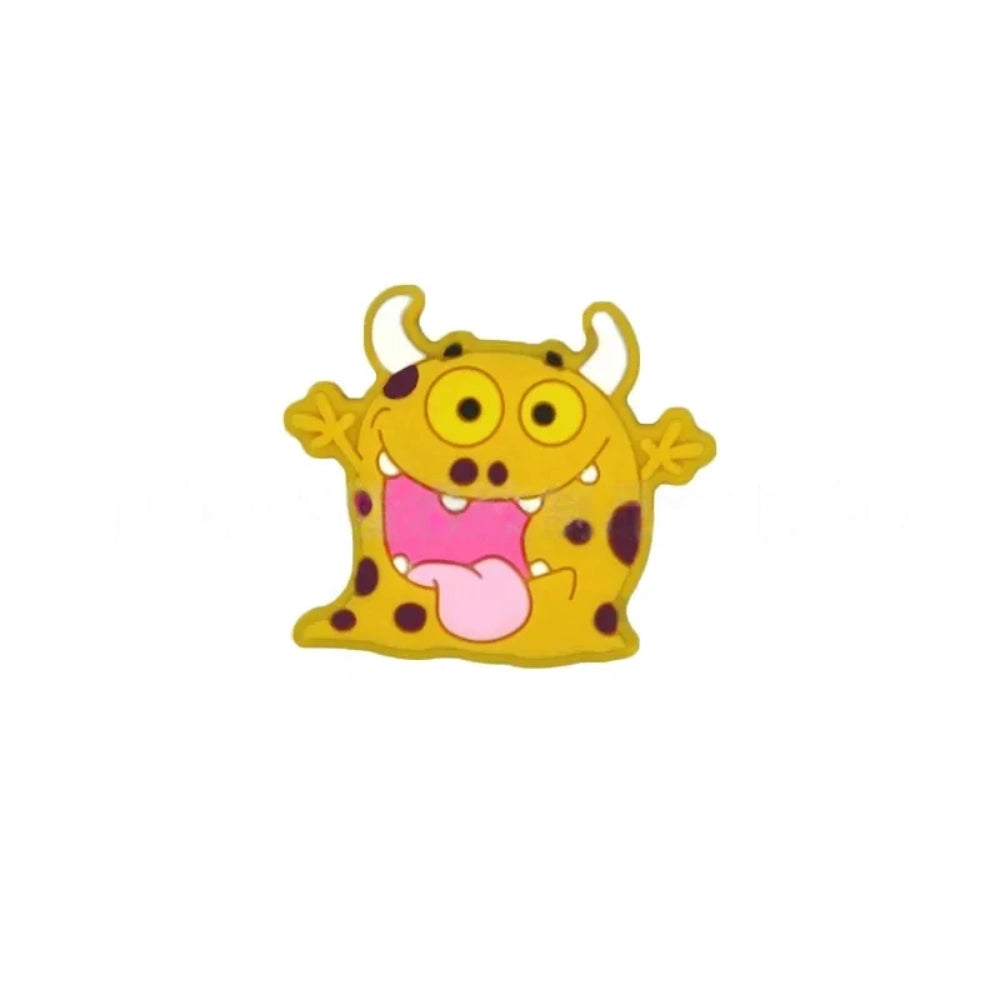 Assorted cartoon monster silicone focal beads in pink, yellow, gray, and mint green with big yellow eyes and horns, displayed in a white ceramic dish for DIY crafting projects. - 5
