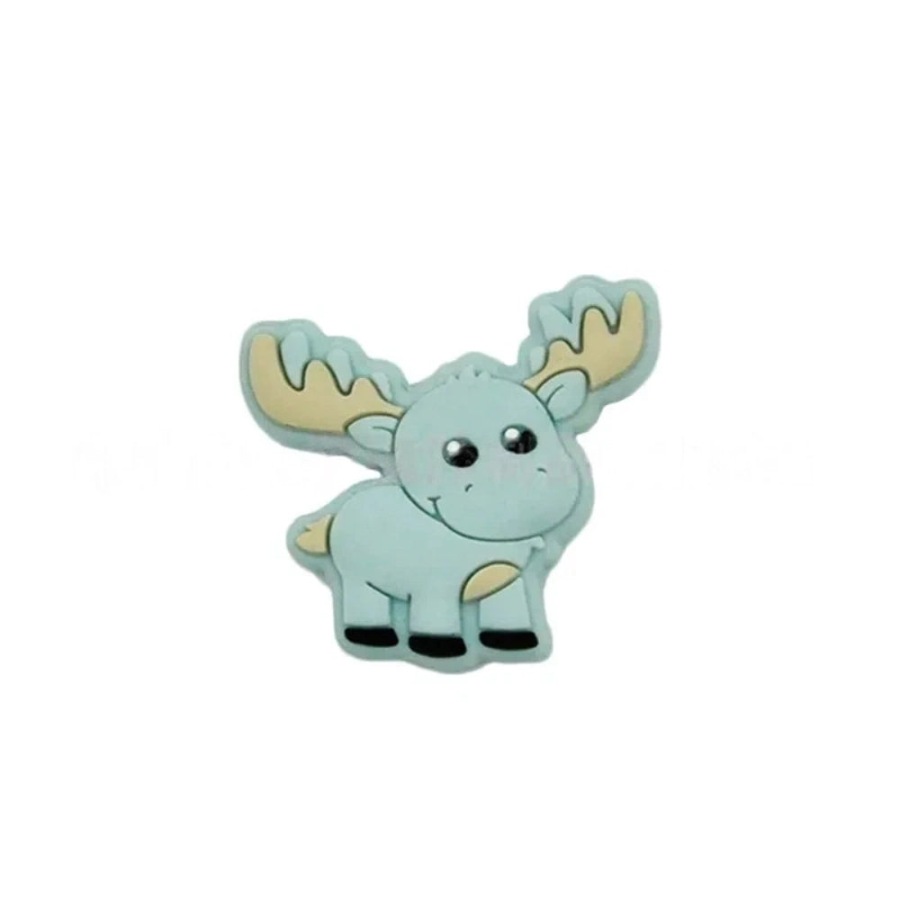 Assorted pastel and earth tone moose silicone focal beads strung on a cord and displayed in a white dish on a teal background, ideal for beadable pens, keychains, and badge reels. - 7