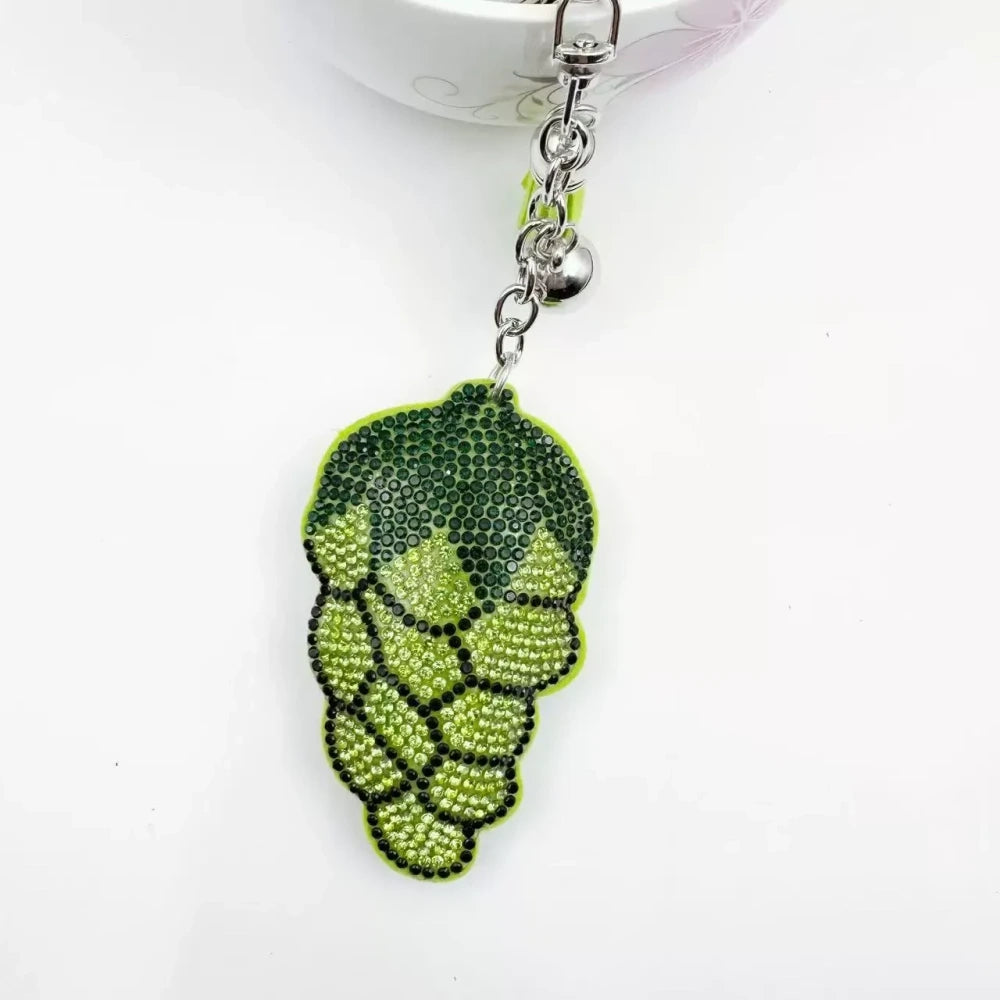 Four multicolor grape cluster rhinestone fancy beads shown as keychain charms with tassels and silver hardware. - Green