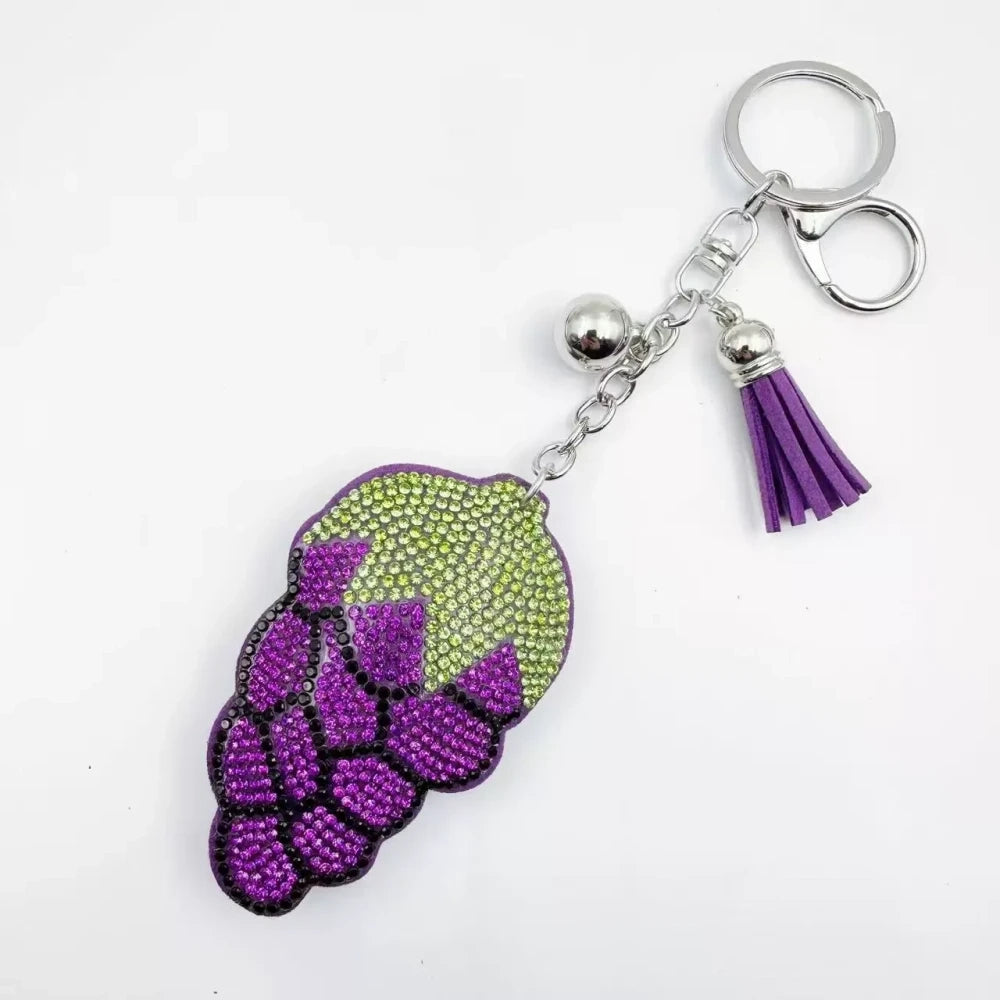 Four multicolor grape cluster rhinestone fancy beads shown as keychain charms with tassels and silver hardware. - Purple