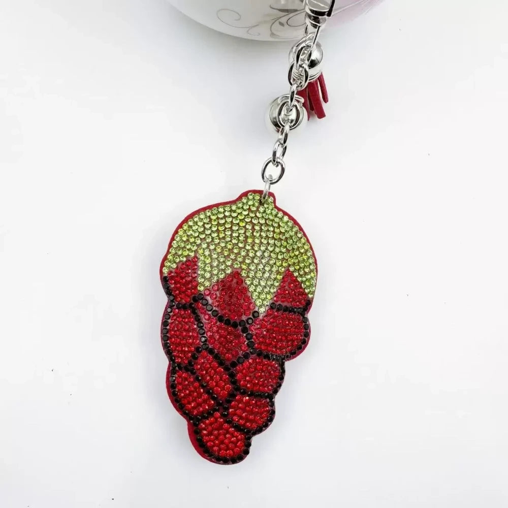 Four multicolor grape cluster rhinestone fancy beads shown as keychain charms with tassels and silver hardware. - Red