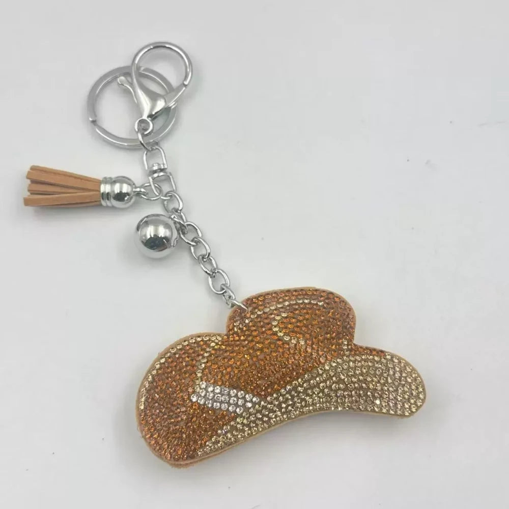 Pink and gold rhinestone cowboy hat fancy bead charms with tassels and key rings on a white background - Khaki
