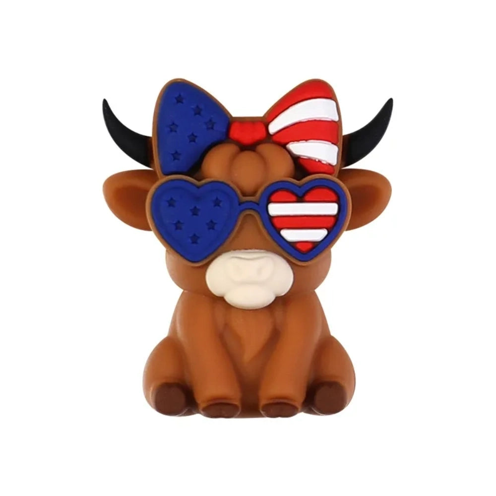 Patriotic God Bless USA silicone focal beads in red, white, and blue featuring roosters, highland cows with heart sunglasses, bows, and coffee mugs on a white background. - 11