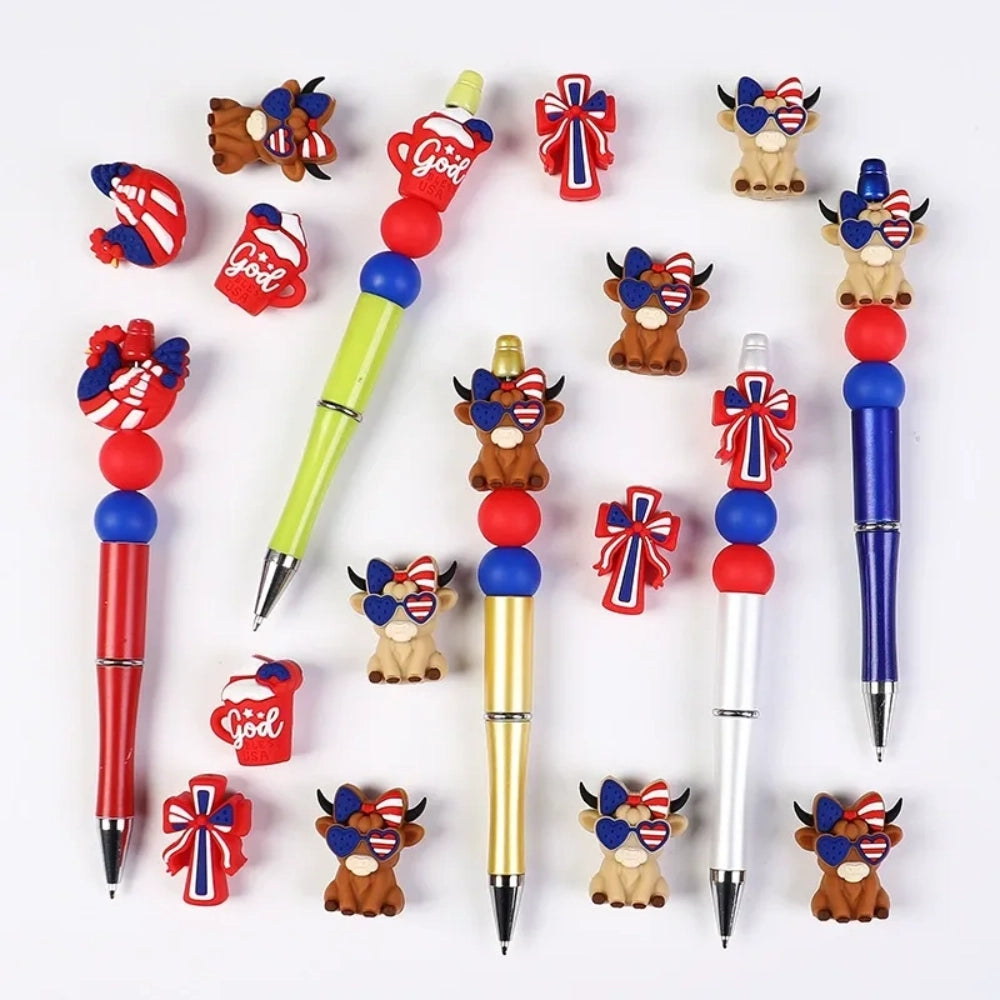 Patriotic God Bless USA silicone focal beads in red, white, and blue featuring roosters, highland cows with heart sunglasses, bows, and coffee mugs on a white background. - Random Mixed