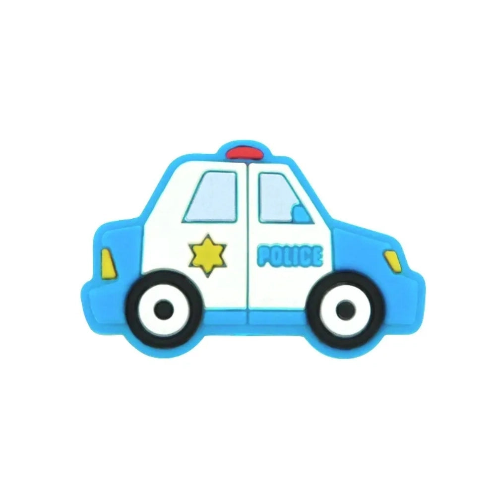 Six cartoon police car silicone focal beads in white, blue, black, mint green, light teal, and yellow displayed on a small wooden bench against a blue background, each featuring a gold sheriff star badge and POLICE text. - 2