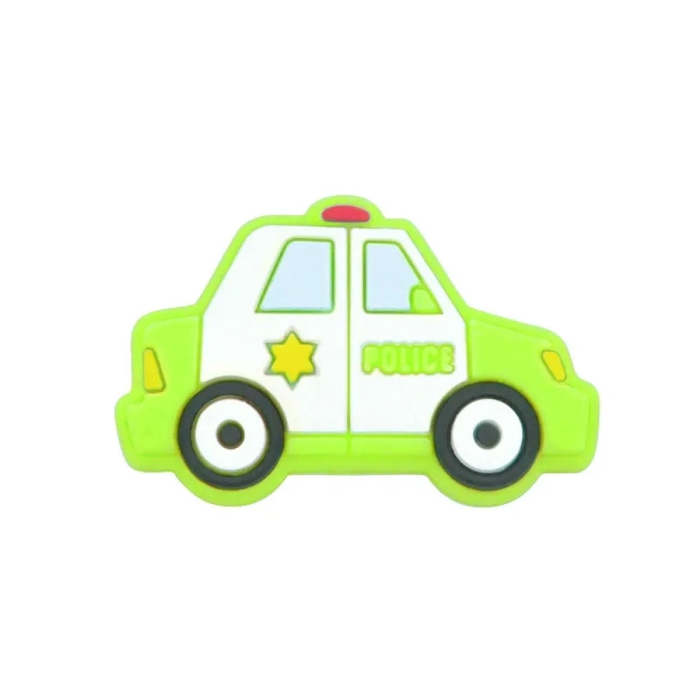 Six cartoon police car silicone focal beads in white, blue, black, mint green, light teal, and yellow displayed on a small wooden bench against a blue background, each featuring a gold sheriff star badge and POLICE text. - 4