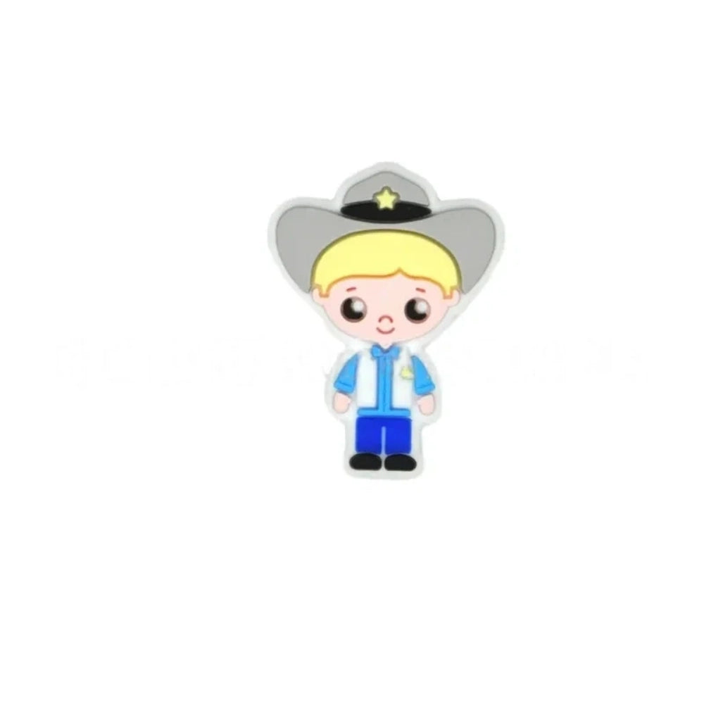 Assorted police girl silicone focal beads in multiple skin tones displayed on a white ceramic dish, featuring cute cartoon cop characters in blue uniforms with stars, perfect for beadable pens, keychains, and badge reels. - 3