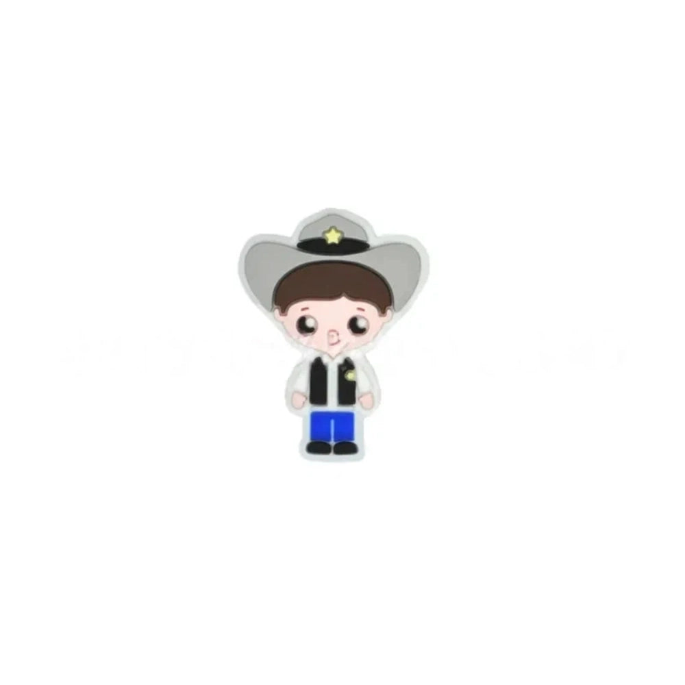 Assorted police girl silicone focal beads in multiple skin tones displayed on a white ceramic dish, featuring cute cartoon cop characters in blue uniforms with stars, perfect for beadable pens, keychains, and badge reels. - 5