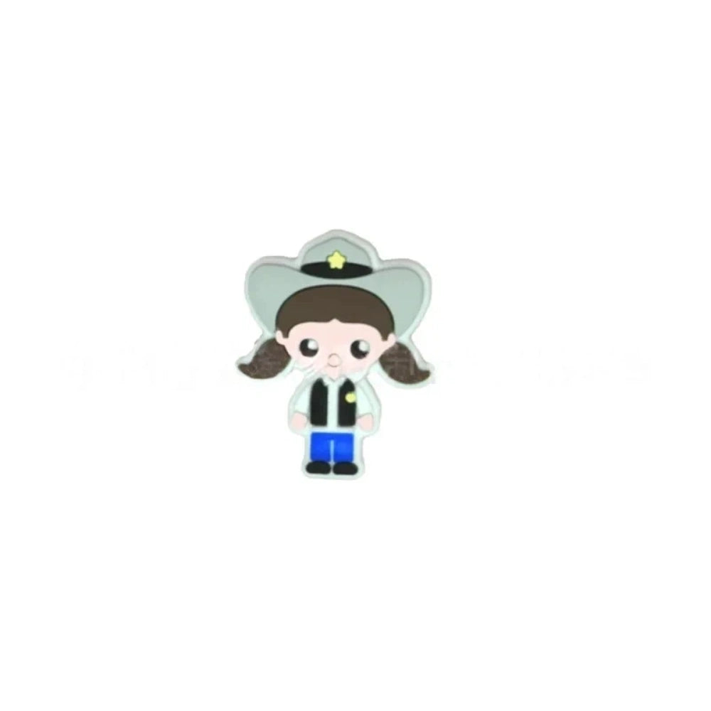 Assorted police girl silicone focal beads in multiple skin tones displayed on a white ceramic dish, featuring cute cartoon cop characters in blue uniforms with stars, perfect for beadable pens, keychains, and badge reels. - 6