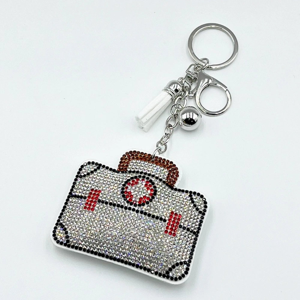Rhinestone crystal camera keychain charm fancy bead with red and black accents, silver key ring, white tassel, and ball charm for DIY jewelry making