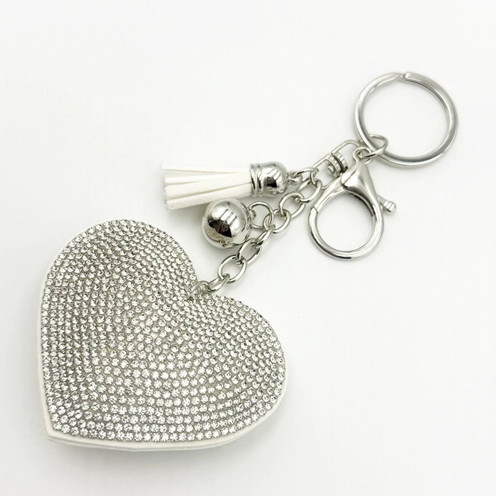 Assorted rhinestone crystal heart-shaped keychains with colorful tassels and lobster clasp in silver and gold tones, available in pink, red, green, yellow, silver, and magenta. - Silver