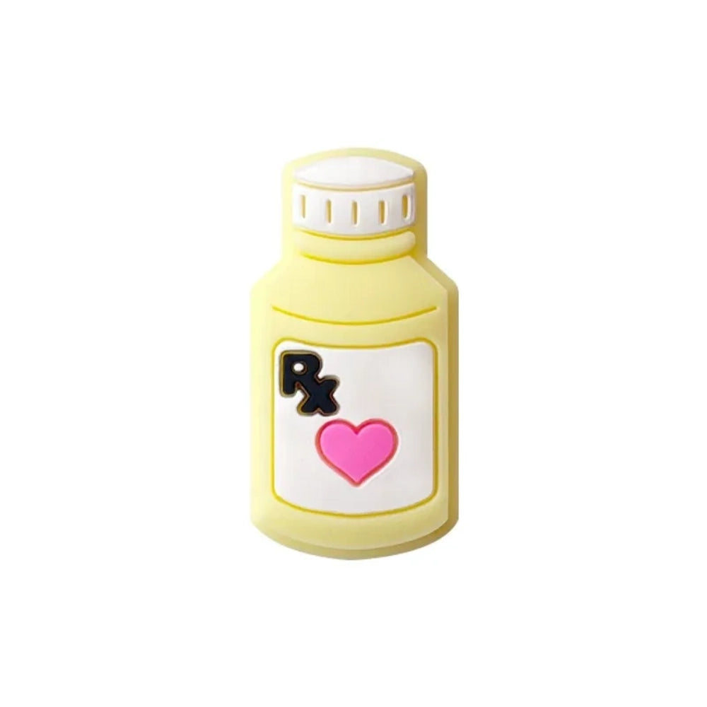 Five colorful silicone RX pill bottle focal beads in purple, teal, yellow, light yellow, and pink, each featuring a heart and RX label design, for DIY crafts and beadable pens. - Creamy Yellow