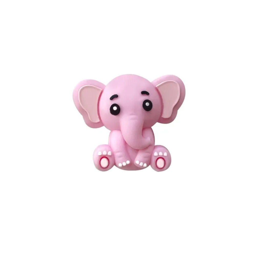 Five cute 3D baby elephant silicone focal beads in light gray, medium gray, dark gray, blue, and pink colors, sitting posed with pink inner ears and toenails, displayed on a white platform against a warm beige background. - Light Pink