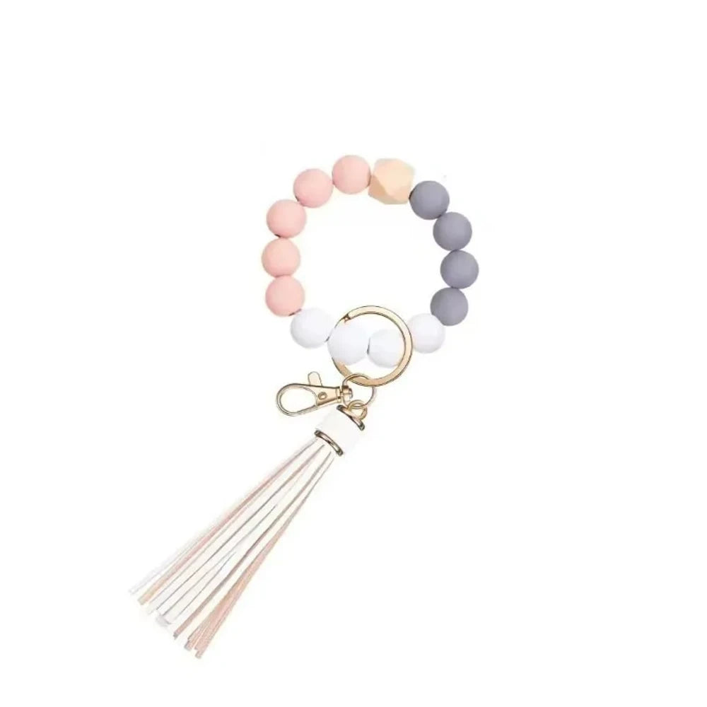 Set of 6 silicone bead wristlet keychains with colorful leather tassels in purple, blue, pink, gray, blush, and black on gold swivel clasps for DIY jewelry making. - 10