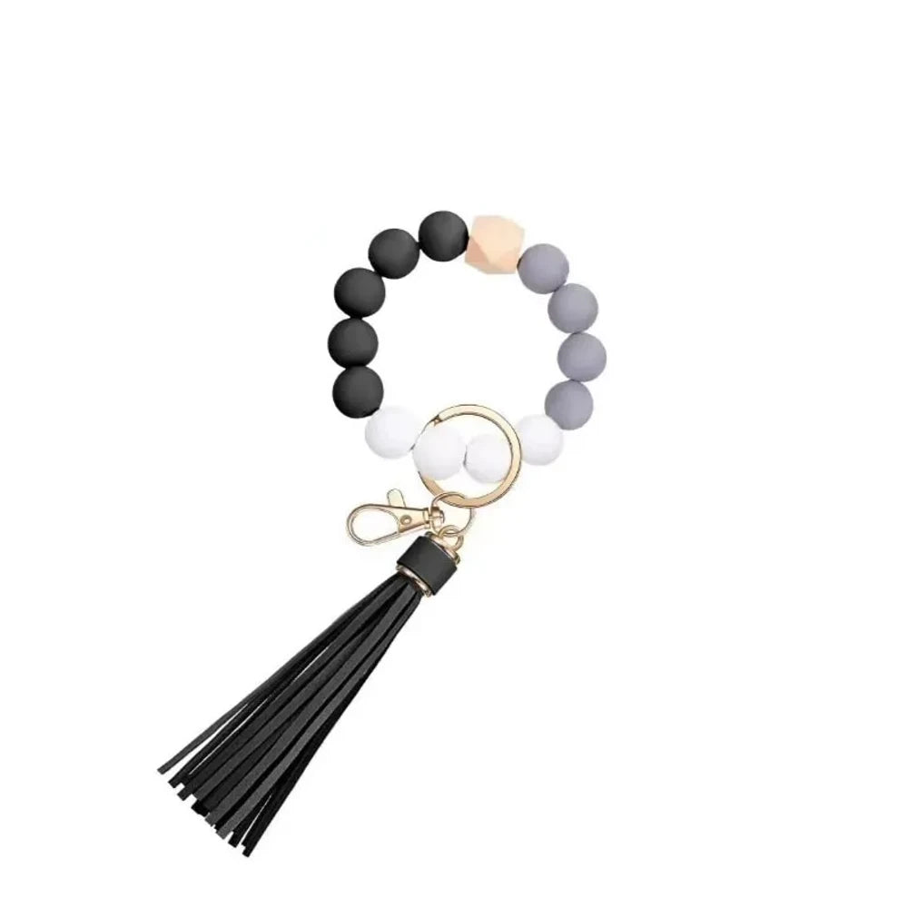 Set of 6 silicone bead wristlet keychains with colorful leather tassels in purple, blue, pink, gray, blush, and black on gold swivel clasps for DIY jewelry making. - 2