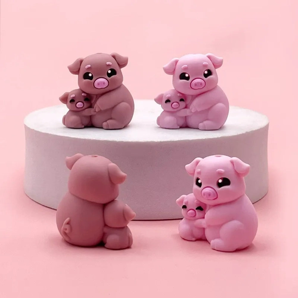 Cute 3D silicone focal beads shaped like a mama pig hugging a baby piglet, shown in light pink and mauve colorways, front and back views displayed on a white pedestal with pink background. - Random Mixed