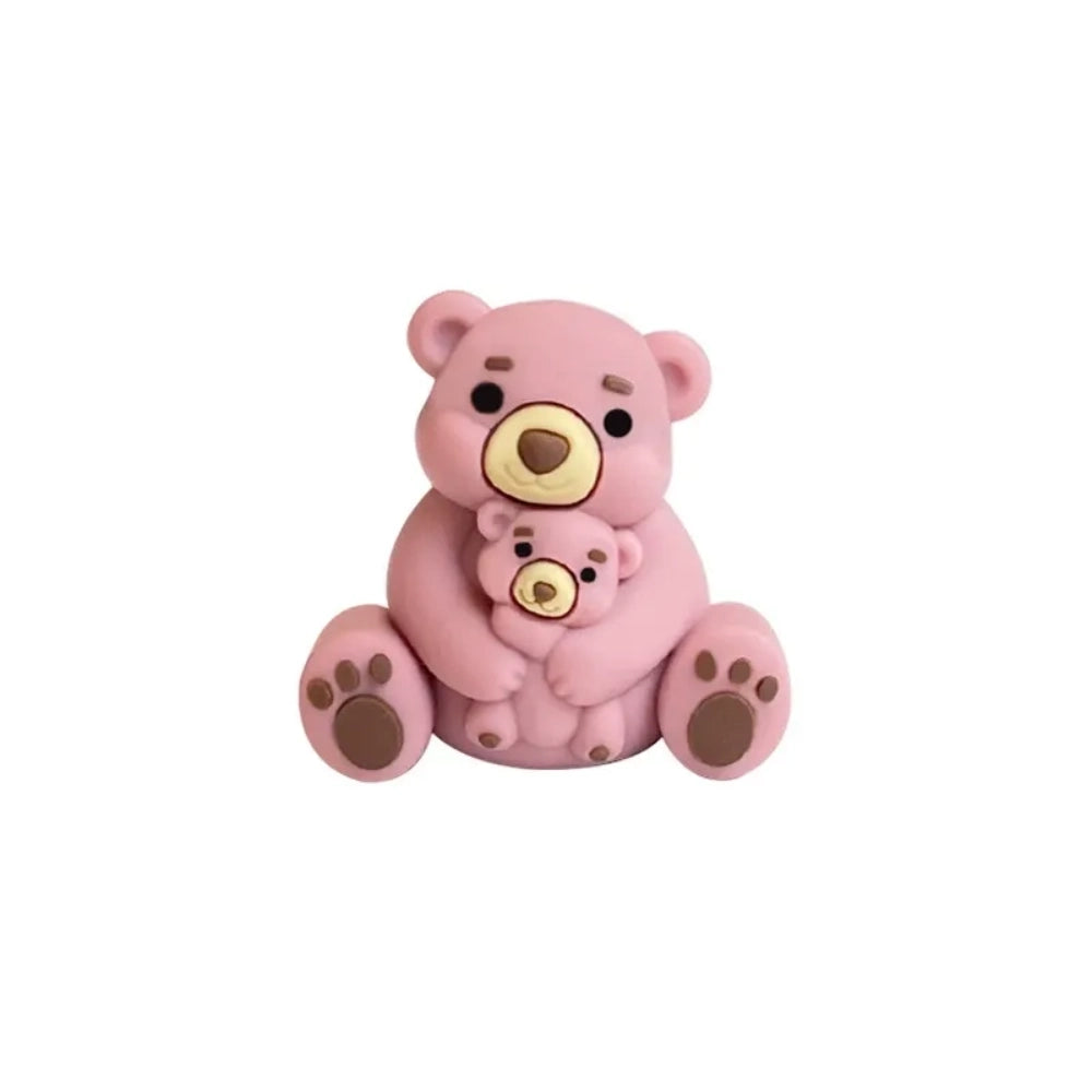 Six colorful 3D silicone focal beads shaped like a mama bear hugging a baby bear, available in gray, brown, yellow, pink, dusty pink, and blue, displayed on a white pedestal with a pink background. - 2