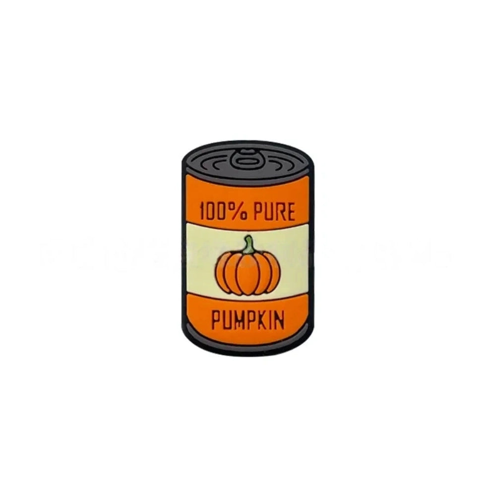 Silicone focal beads shaped like mini canned goods with Apple Pie Filling and 100% Pure Pumpkin labels, displayed in a pile on a pink background. - 1