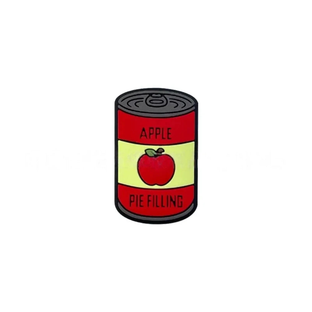 Silicone focal beads shaped like mini canned goods with Apple Pie Filling and 100% Pure Pumpkin labels, displayed in a pile on a pink background. - 2