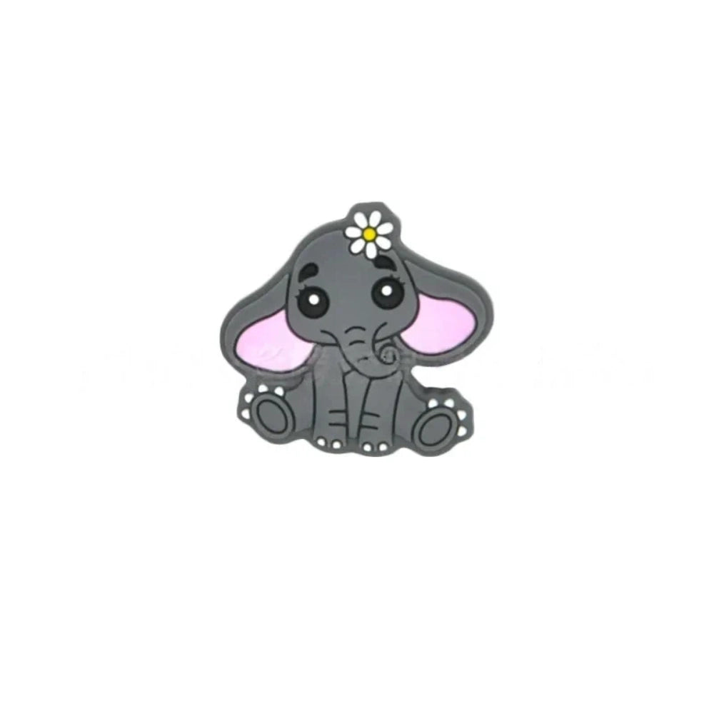 Four silicone focal beads shaped like cute baby elephants with daisy flowers, available in pink, gray, dark gray, and light blue colorways, each featuring pink inner ears and big expressive eyes. - Camel