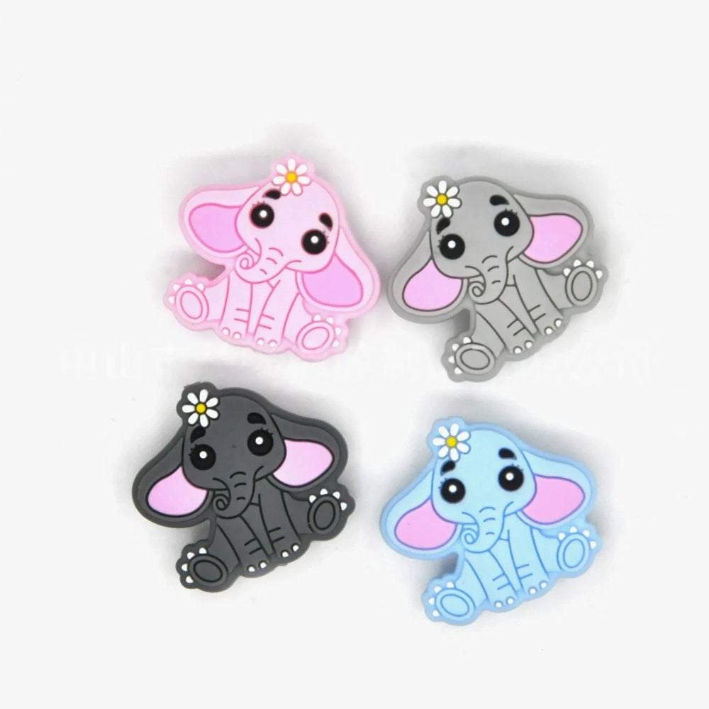 Four silicone focal beads shaped like cute baby elephants with daisy flowers, available in pink, gray, dark gray, and light blue colorways, each featuring pink inner ears and big expressive eyes. - Random Mixed