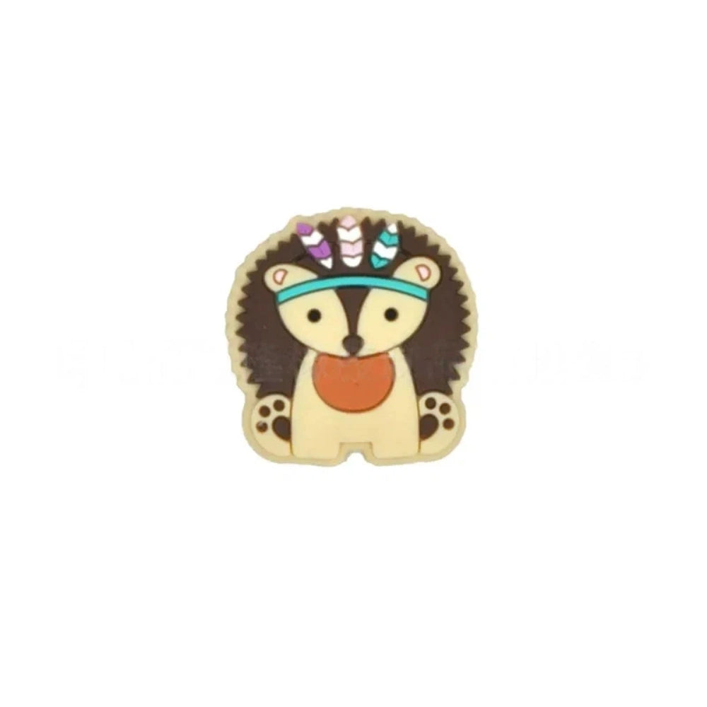 Five boho tribal animal silicone focal beads in pink, blue, yellow, brown, and gray featuring hedgehog, elephant, and lion characters wearing feathered headbands, displayed on a white background. - Brown
