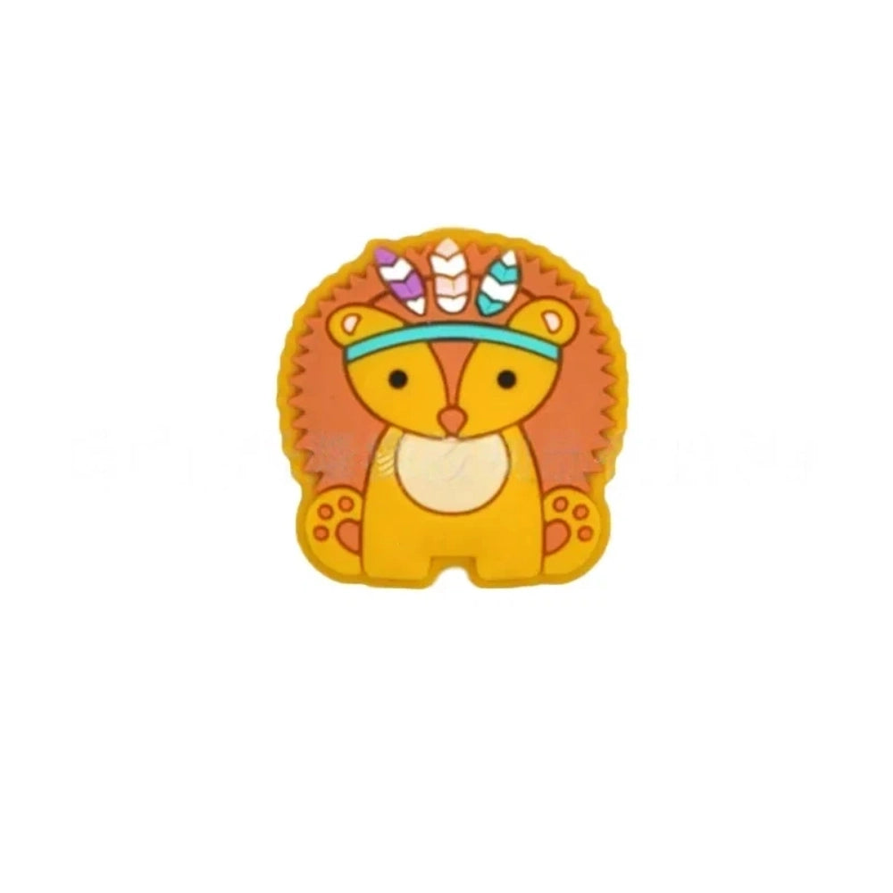 Five boho tribal animal silicone focal beads in pink, blue, yellow, brown, and gray featuring hedgehog, elephant, and lion characters wearing feathered headbands, displayed on a white background. - Orange