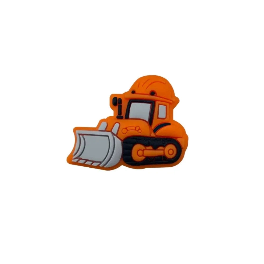 Five colorful silicone bulldozer construction truck focal beads in yellow, dark yellow, orange, blue, and mint green displayed on a white round platform - Orange