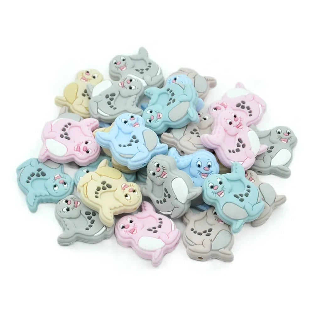 Assorted pastel colored bunny rabbit silicone focal beads in gray, pink, blue, and cream for DIY jewelry making and beadable pens