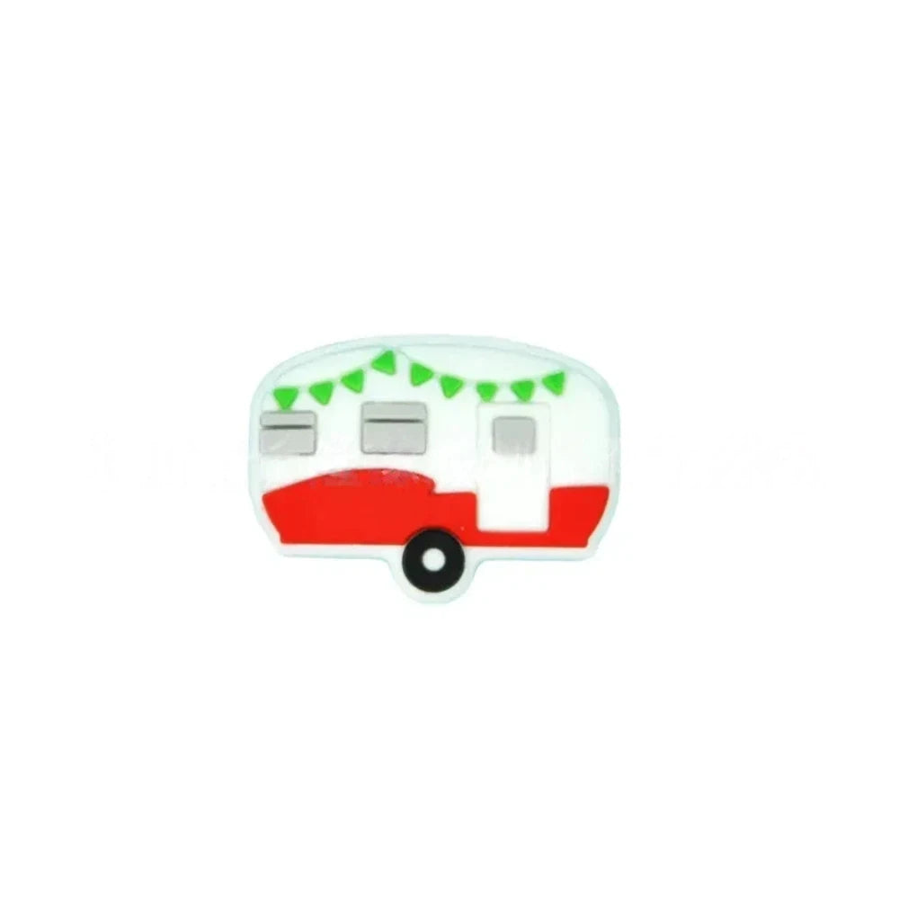 Four silicone camper trailer flatback focal beads in red, black, teal, and pink with bunting flag details on a teal background - Red