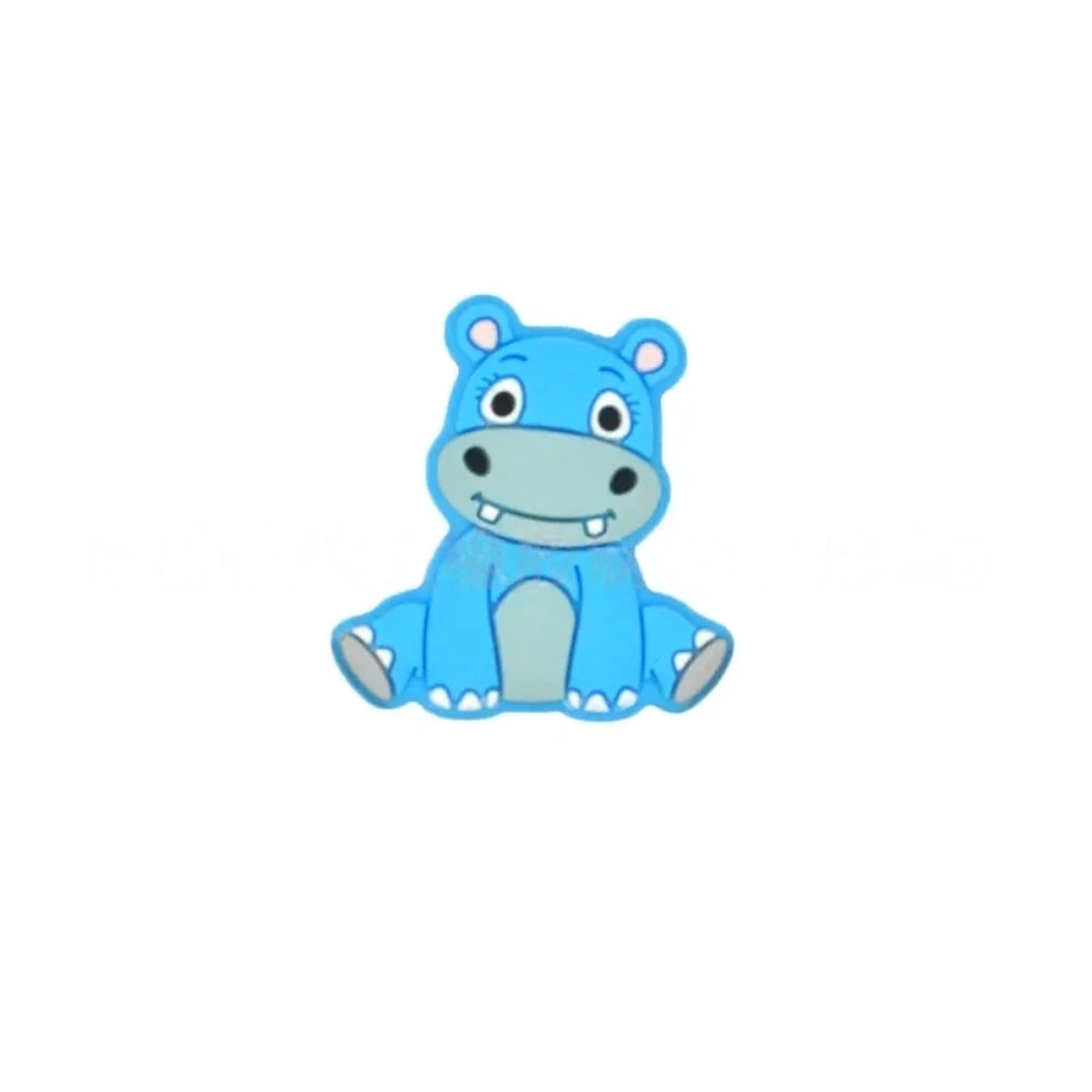 Six cartoon hippo silicone focal beads in blue, mint green, purple, dark gray, light gray, and pink, shown in a 2x3 grid on white background. - Blue
