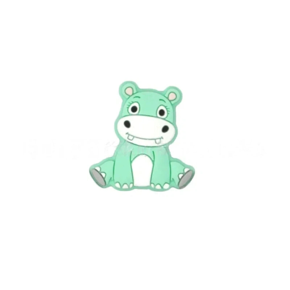 Six cartoon hippo silicone focal beads in blue, mint green, purple, dark gray, light gray, and pink, shown in a 2x3 grid on white background. - Green