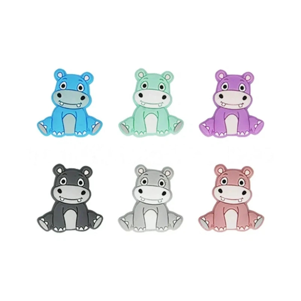 Six cartoon hippo silicone focal beads in blue, mint green, purple, dark gray, light gray, and pink, shown in a 2x3 grid on white background. - Random Mixed