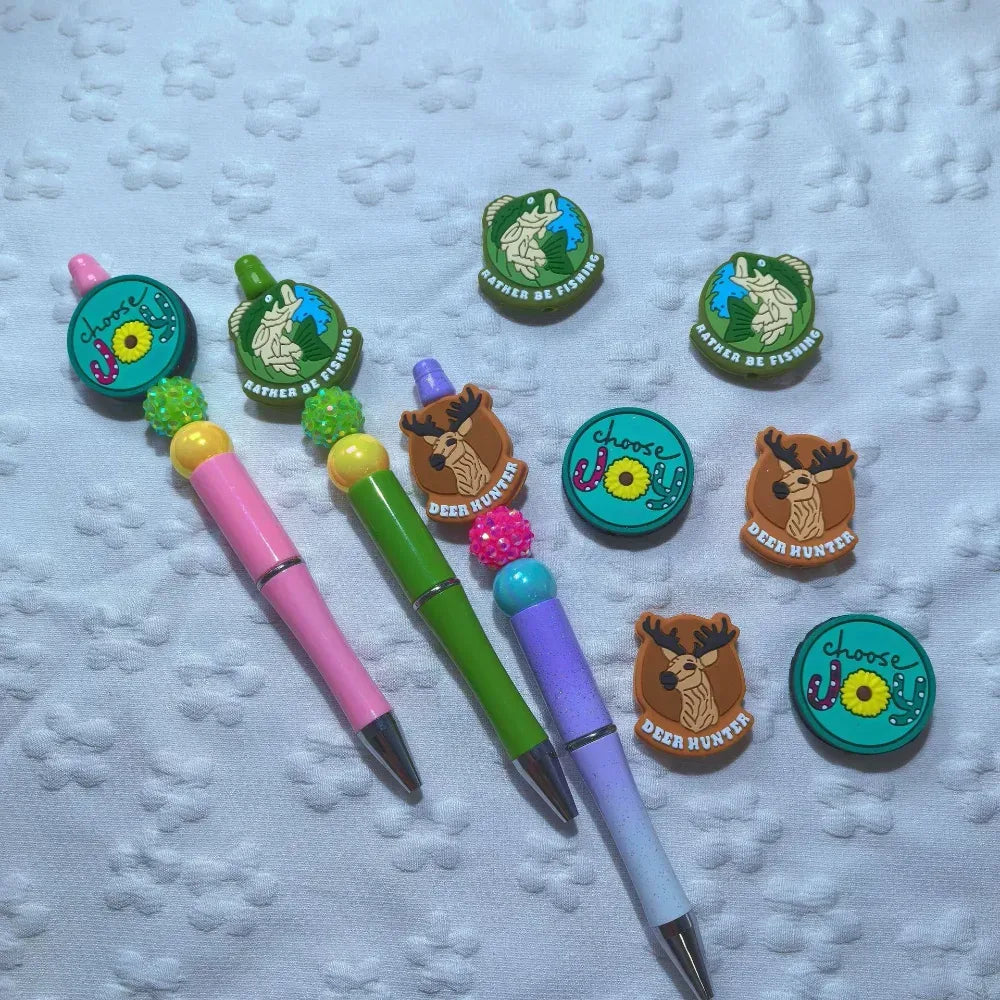 Set of six silicone focal beads featuring Choose Joy sunflower, Deer Hunter buck mount, and Rather Be Fishing bass designs in teal, brown, and green colorways. - Random Mixed