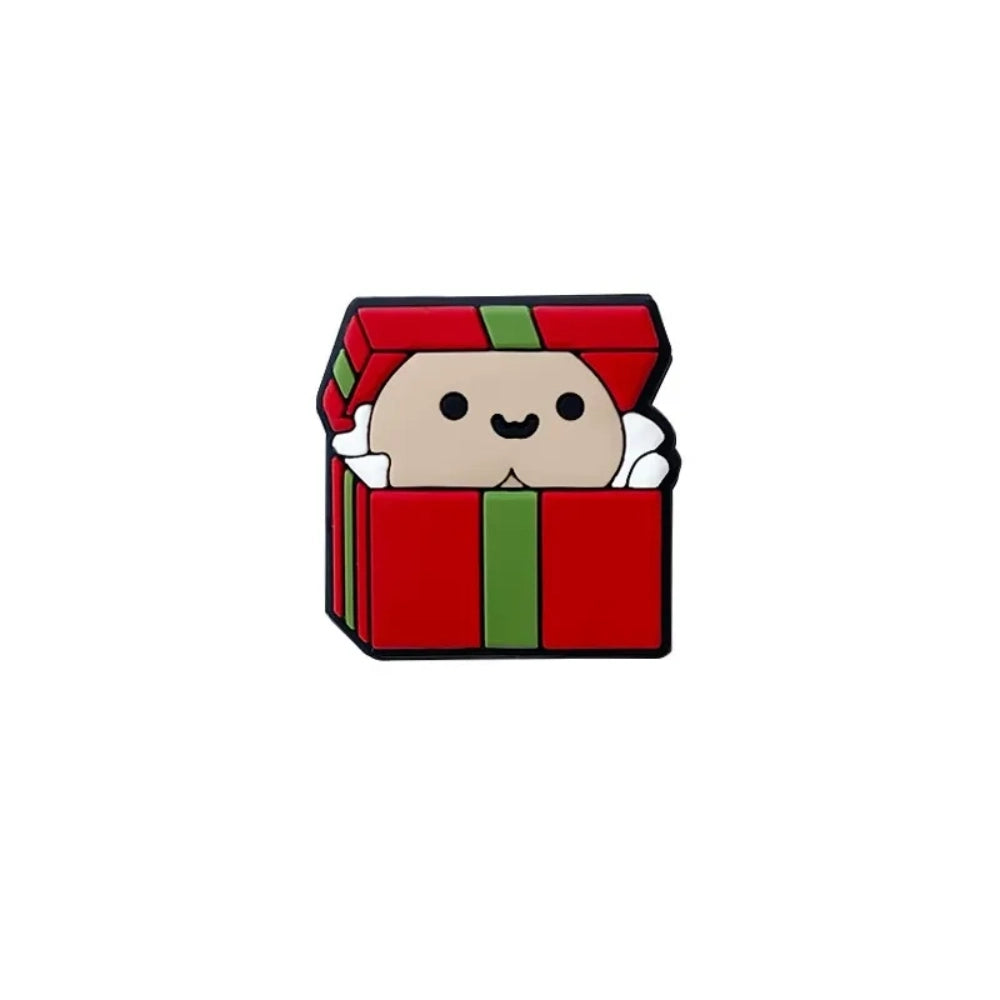 Cute silicone focal beads shaped like red and green Christmas gift boxes with smiling character faces peeking out, shown in multiple skin tone variations on a wooden display tray. - 2