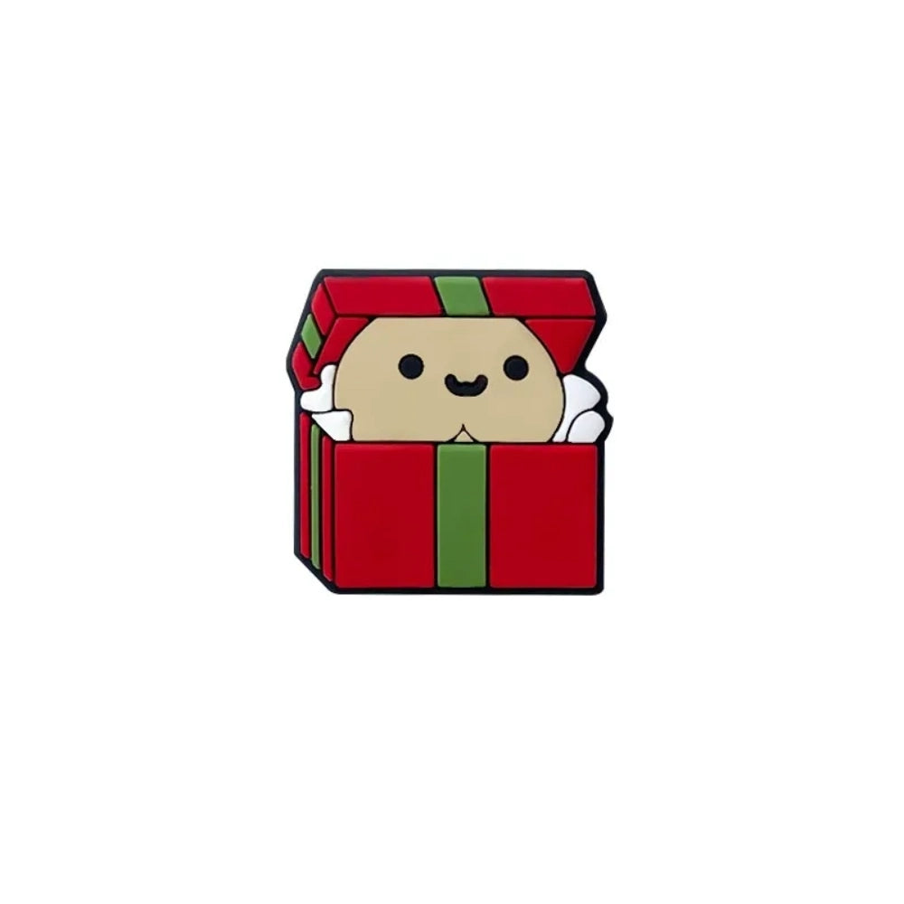 Cute silicone focal beads shaped like red and green Christmas gift boxes with smiling character faces peeking out, shown in multiple skin tone variations on a wooden display tray. - 3