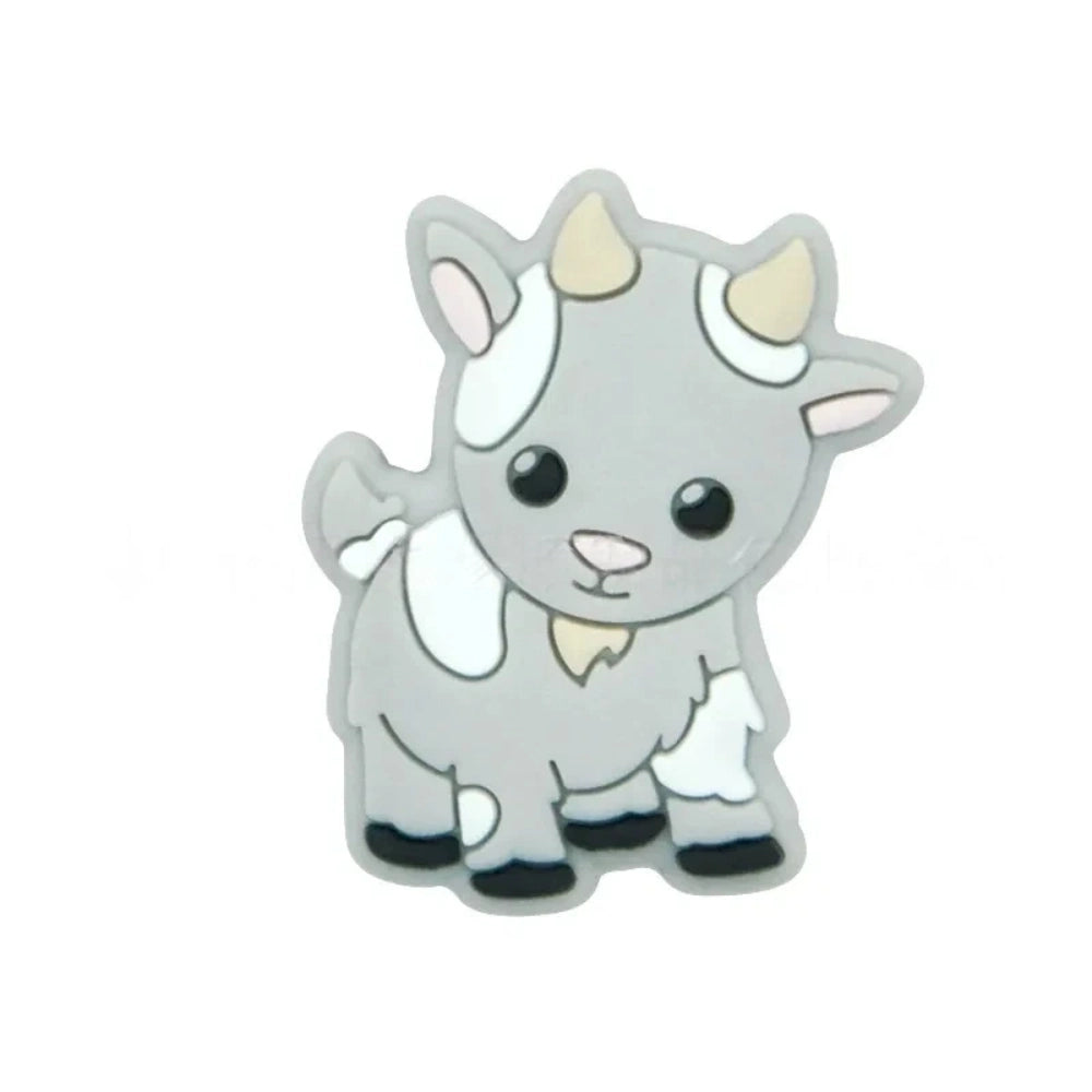 Assorted pastel color cute cow silicone focal beads displayed on a white shell dish and strung on a white cord against a teal background, available in gray, green, pink, tan, and white colorways. - Light Gray