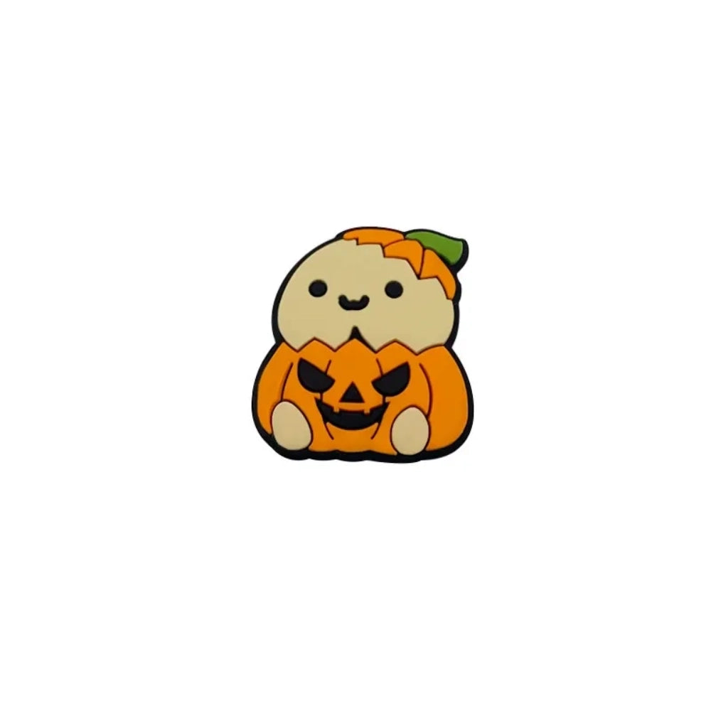 Four cute silicone focal beads featuring cartoon critters sitting inside jack-o-lantern pumpkin costumes, available in light and brown character skin tones, displayed on a white platform with a warm beige background. - Brown