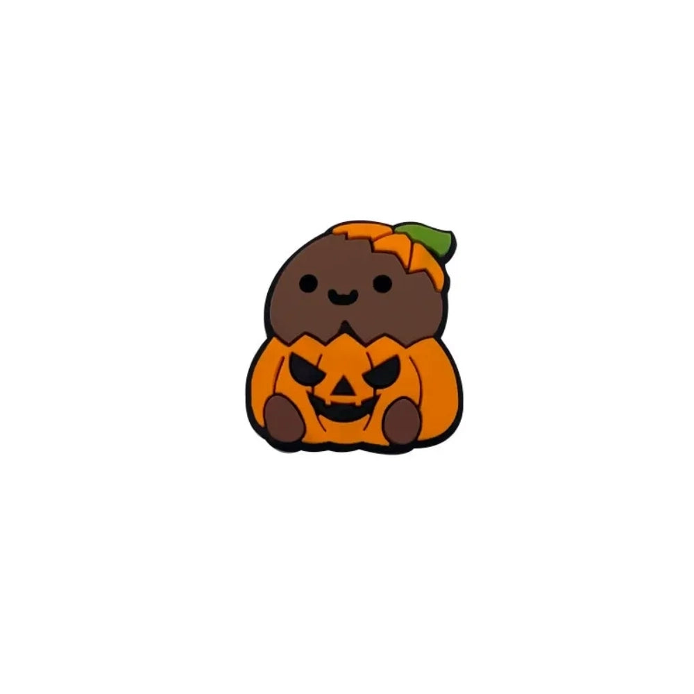 Four cute silicone focal beads featuring cartoon critters sitting inside jack-o-lantern pumpkin costumes, available in light and brown character skin tones, displayed on a white platform with a warm beige background. - Coffee