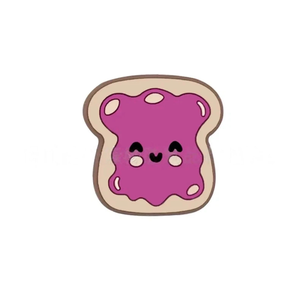 Five kawaii toast spread silicone focal beads in chocolate, pink jam, red jam, grape jam, and peanut butter designs, displayed on colorful beadable pens against a pink background. - Purple