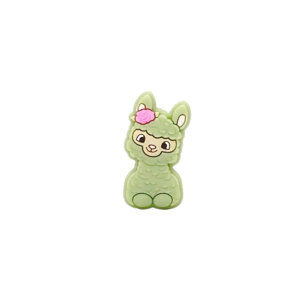 Ten colorful silicone llama alpaca focal beads in white, pink, light pink, cream, peach, green, gray, yellow, blue, and dark brown, displayed in two rows on a white background. - Matcha Green